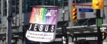 A street ministry speaking to Jesus saving souls via a multicolor display.