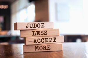 Race Conscious Affirmative Action - Time Is Up (IMAGE 2): A stack of vertical blocks that read "JUDGE LESS ACCEPT MORE".